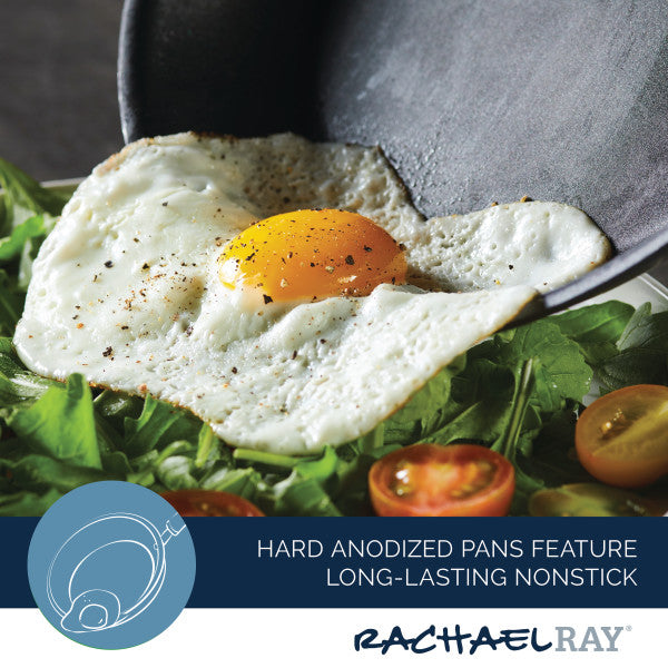 A fried egg rests atop a fresh salad, elegantly served from the 11-Piece Professional Hard-Anodized Nonstick and Induction Stainless Steel Cookware Set.