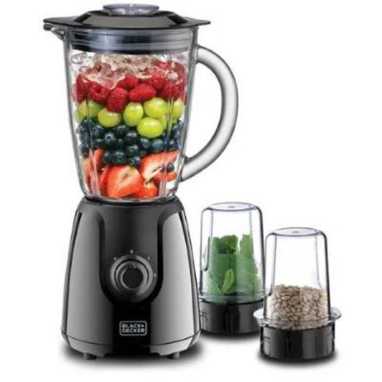 Black and Decker blender with fruits and vegetables inside on a white background