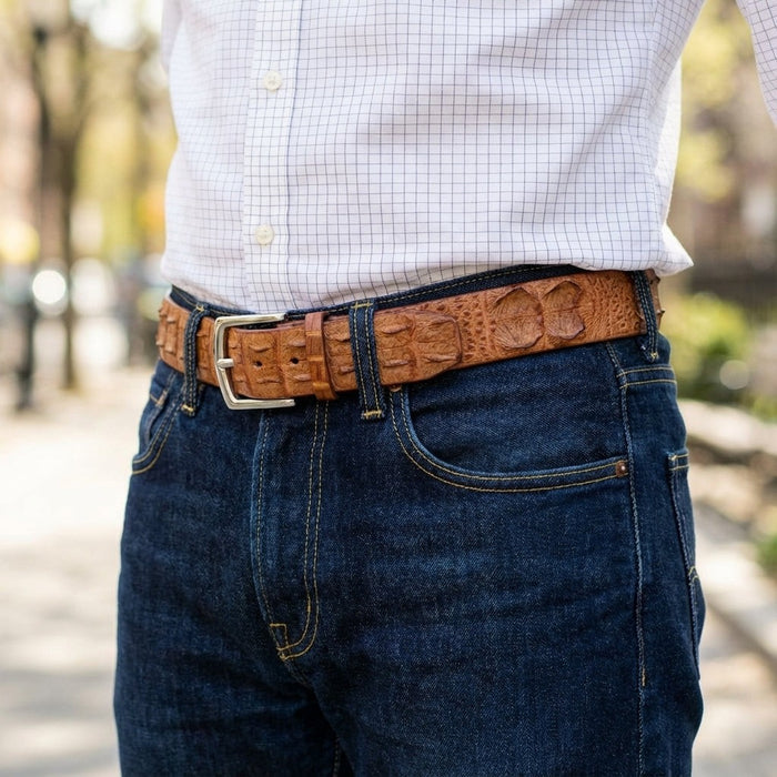 Man wearing handmade brown crocodile leather belt with blue jeans