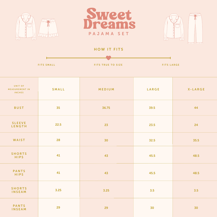 A size chart for The Darling Effect's Jolly Sprig Sweet Dreams Pajama Shorts Set, featuring bust, sleeve, waist, hip, and inseam measurements (in inches) for sizes Small–X-Large. Showcases a pink and gold cozy pajama shorts set.