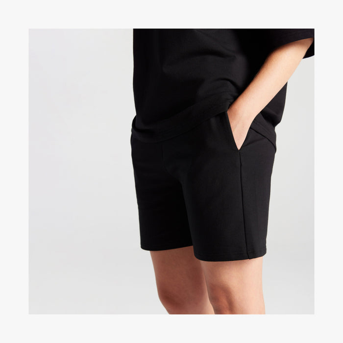 Black | Side pocket view of woman in Kyoto Shorts in Black