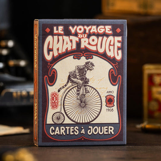 Le Voyage du Chat RougePlaying card box with vintage design featuring a cat on a bicycle