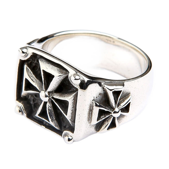 A 925 sterling silver Maltese cross ring, expertly handcrafted with a high-contrast polished and darkened finish.