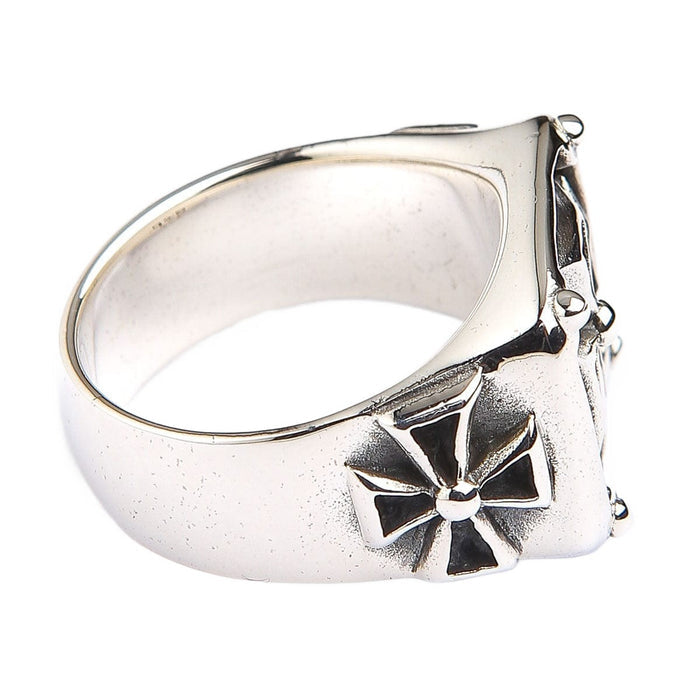 Side profile of the sterling silver Maltese cross ring showing the raised eight-point cross on the shank.