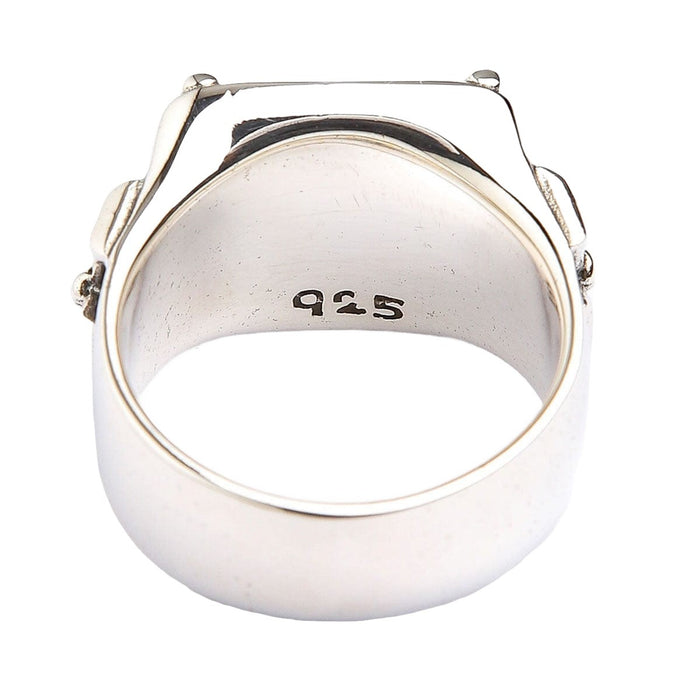 Inside of the flat band showing the 925 sterling silver hallmark stamped on the inner surface.