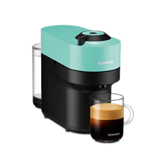 Turquoise and black Nespresso coffee machine with a glass of coffee on a white background