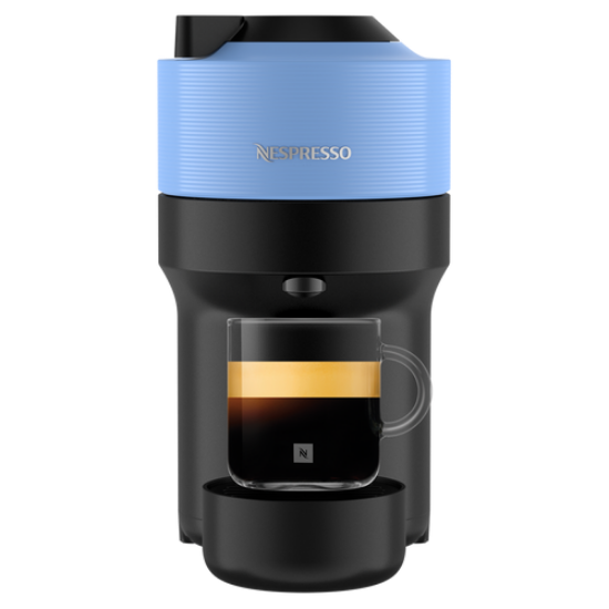 Nespresso coffee machine with a glass of coffee on a white background
