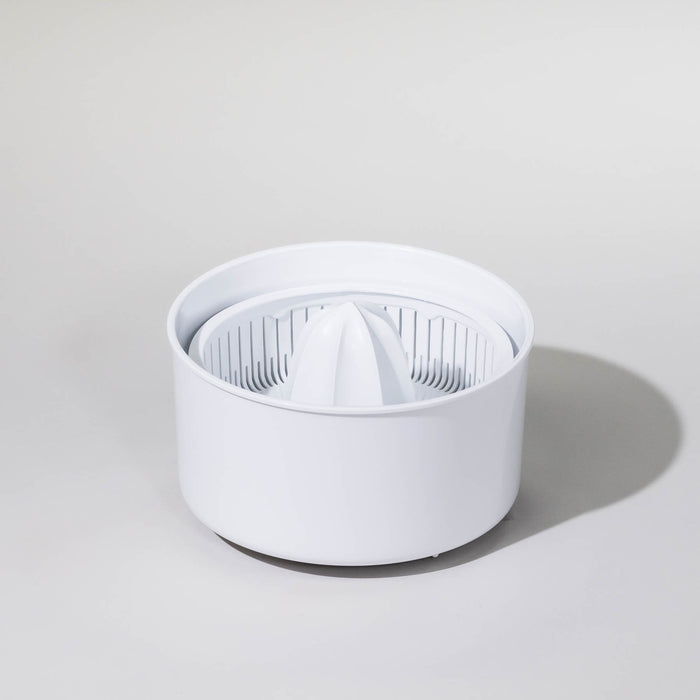Bosch compact mixer citrus juicer attachment on a grey background