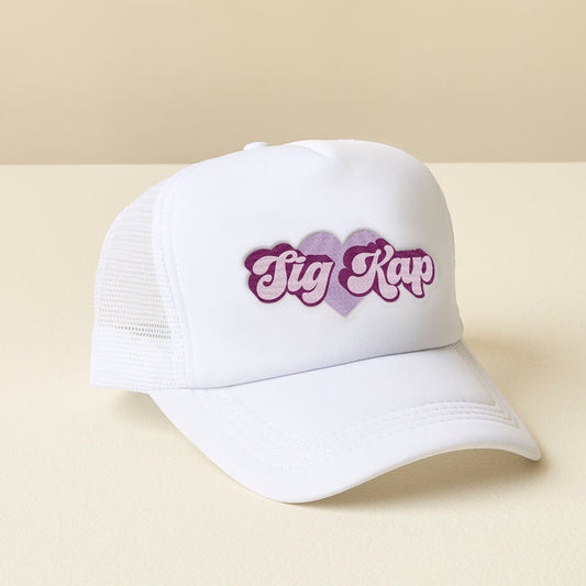 The Darling Effect's Sigma Kappa White Trucker Hat features two overlapping purple hearts and "Tig Kap" in stylized purple and white letters on a white mesh trucker design—perfect for showing off your chapter pride.