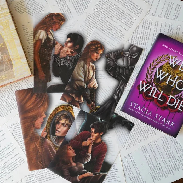 Five We Who Will Die LitJoy Edition page overlay art cards scattered on open book pages, featuring full-color character illustrations including romantic and action scenes from Stacia Stark's novel, beside the purple book cover