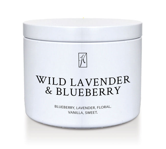 White tin candle container with 'Wild Lavender & Blueberry' text on a white background